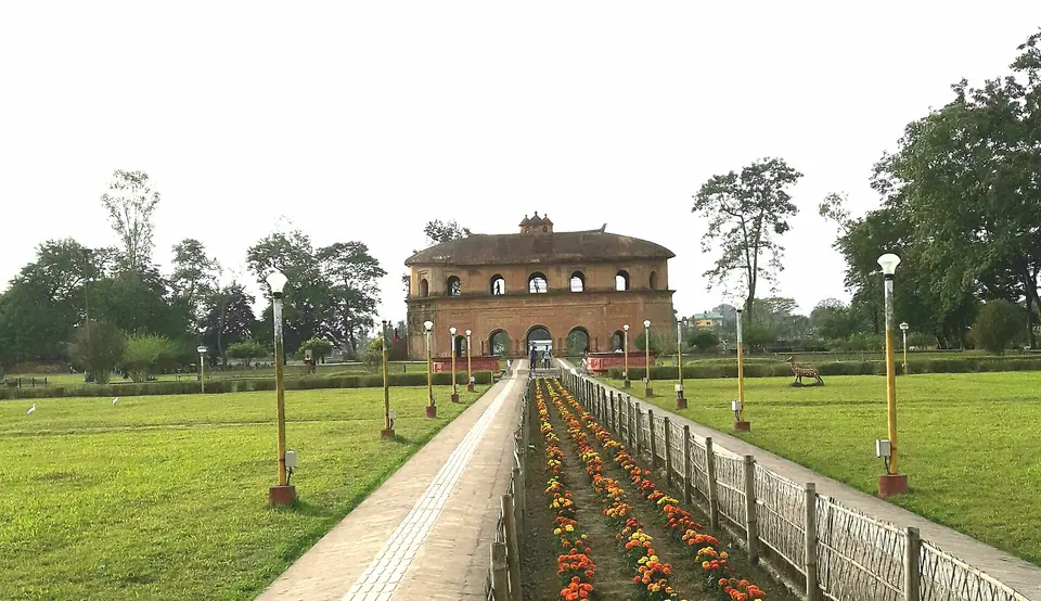 A long flower-lined path leading to the two-storey Rang Ghar pavilion of the Ahom kings, Sivasagar