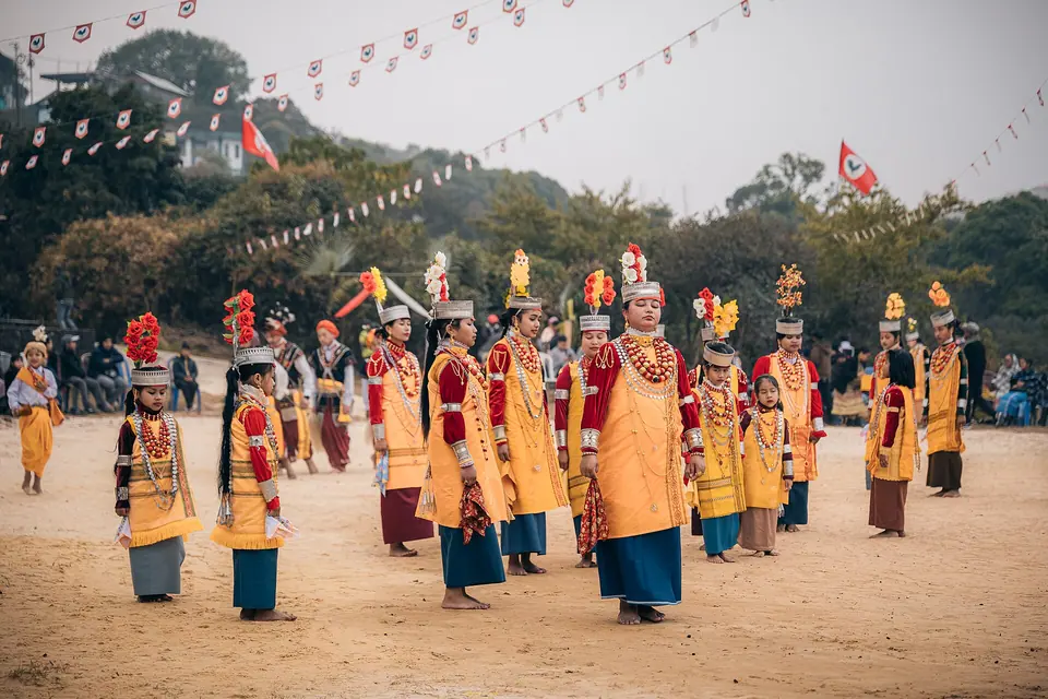Khasi women in silk, gold and silver crowns dancing at Shad Suk Mynsiem
